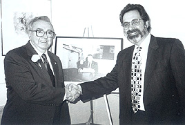 WFEA general manager Ray Garon congratulates Joe Maltais on his retirement - February 9, 1996